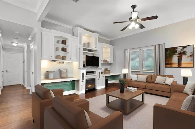 108 Neely Rd, Hewitt, TX 76643 - living room with crown molding, ceiling fan, wood finished floors, baseboards, and a warm lit fireplace