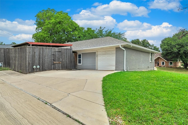 3806 Rainier St, Irving, TX 75062 - view of side of home with a yard, driveway, brick siding, a garage, and a shingled roof
