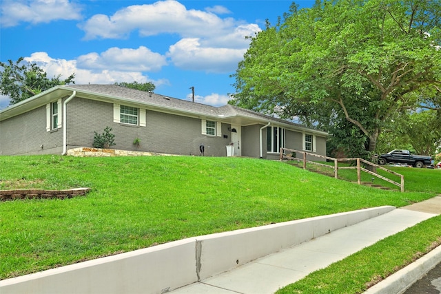 3806 Rainier St, Irving, TX 75062 - ranch-style home featuring a front yard and brick siding