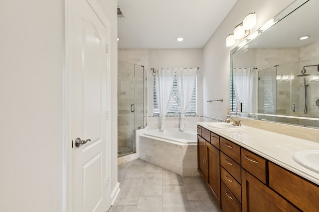 2022 N Fitzhugh Ave Unit E, Dallas, TX 75204 - full bathroom featuring a bath, double vanity, a stall shower, tile patterned flooring, and recessed lighting