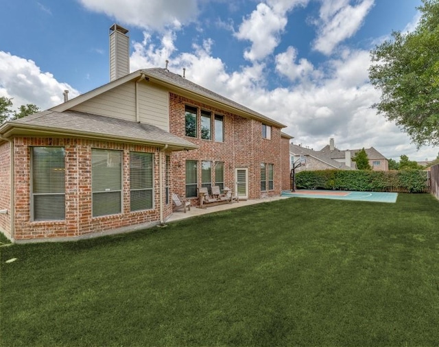 535 Cedarbird Trl, Murphy, TX 75094 - back of house featuring a patio, brick siding, a chimney, and roof with shingles