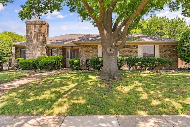 4425 Fremont Ln, Plano, TX 75093 - view of front of property with brick siding, a front yard, and a chimney