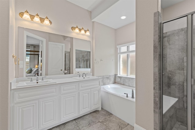 945 Colby Bluff Dr, Rockwall, TX 75087 - full bath featuring a stall shower, a garden tub, and double vanity