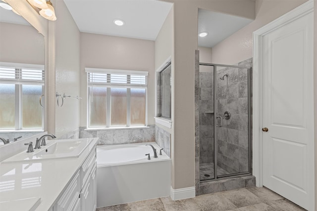 945 Colby Bluff Dr, Rockwall, TX 75087 - full bath featuring vanity, a bath, a shower stall, and plenty of natural light