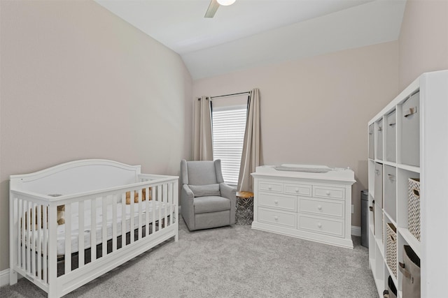 945 Colby Bluff Dr, Rockwall, TX 75087 - bedroom with light carpet, lofted ceiling, a ceiling fan, a crib, and baseboards