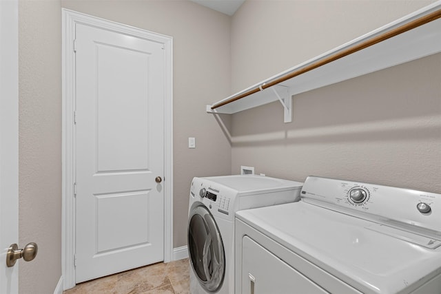 945 Colby Bluff Dr, Rockwall, TX 75087 - laundry room featuring washing machine and dryer and baseboards