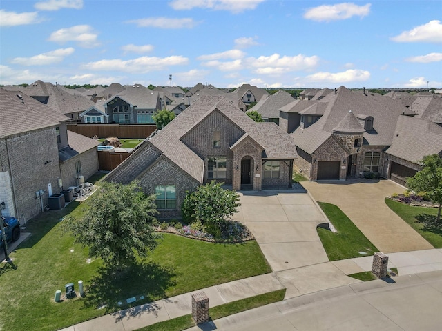 945 Colby Bluff Dr, Rockwall, TX 75087 - french provincial home with a residential view, driveway, brick siding, stone siding, and roof with shingles