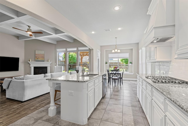 945 Colby Bluff Dr, Rockwall, TX 75087 - kitchen with custom range hood, appliances with stainless steel finishes, recessed lighting, a sink, and backsplash