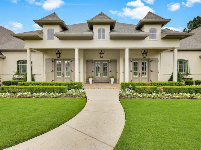 2161 Honey Ln, Celina, TX 75009 - entrance to property with french doors, a yard, roof with shingles, and stucco siding