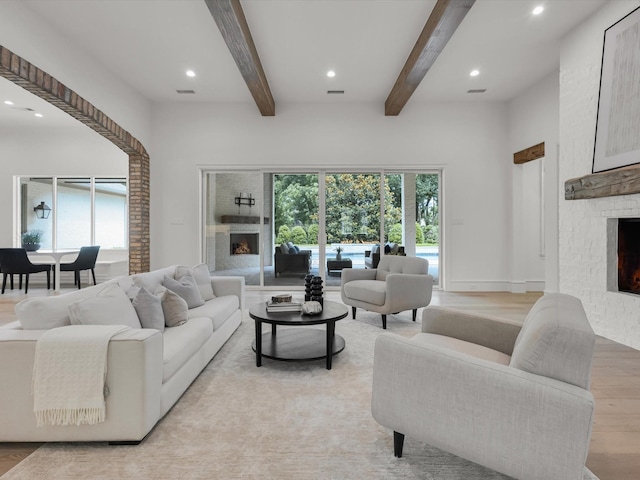 2161 Honey Ln, Celina, TX 75009 - living area featuring a large fireplace, recessed lighting, beamed ceiling, and light wood-style floors