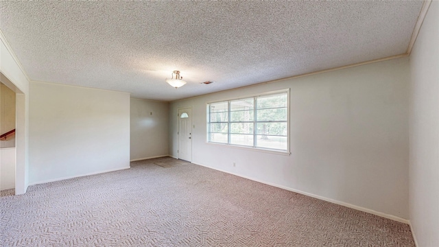 10335 Nolan Dr, Tyler, TX 75709 - carpeted empty room featuring a textured ceiling and baseboards