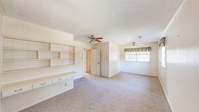 10335 Nolan Dr, Tyler, TX 75709 - empty room with light colored carpet, a textured ceiling, ceiling fan, and baseboards