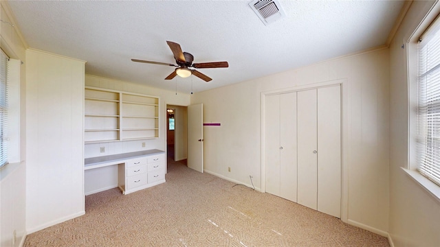 10335 Nolan Dr, Tyler, TX 75709 - unfurnished office featuring plenty of natural light, light colored carpet, a ceiling fan, and a textured ceiling