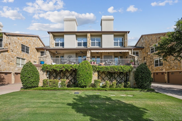 2590 King Arthur Blvd, Lewisville, TX 75056 - view of front of house featuring ceiling fan, a chimney, a front lawn, and driveway
