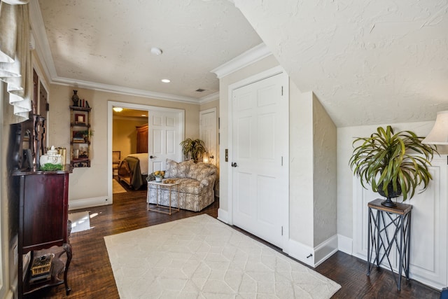 2590 King Arthur Blvd, Lewisville, TX 75056 - foyer with wood finished floors, ornamental molding, baseboards, and a textured ceiling