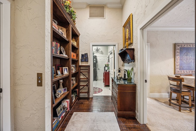 2590 King Arthur Blvd, Lewisville, TX 75056 - hall featuring a textured wall, ornamental molding, and baseboards
