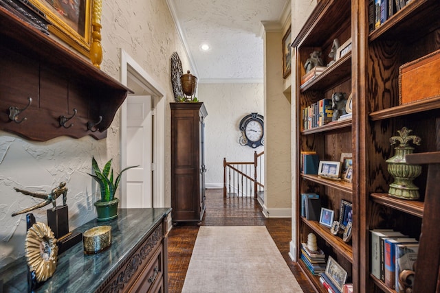 2590 King Arthur Blvd, Lewisville, TX 75056 - hallway featuring an upstairs landing, a textured wall, dark wood-style floors, ornamental molding, and a textured ceiling