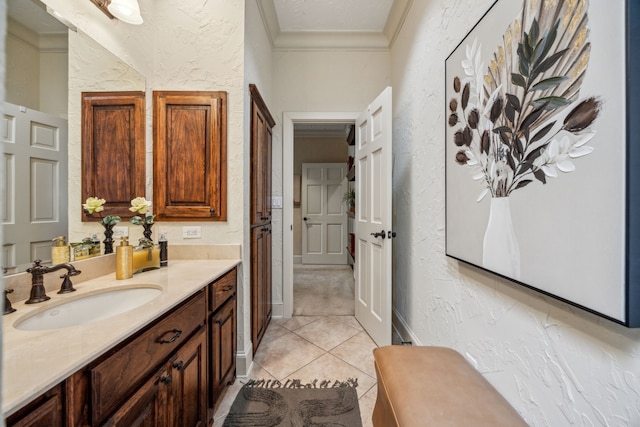 2590 King Arthur Blvd, Lewisville, TX 75056 - bathroom with ornamental molding, a textured wall, vanity, and tile patterned floors