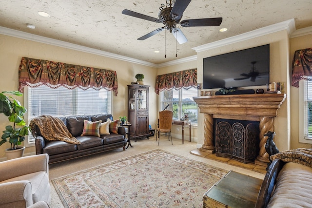 2590 King Arthur Blvd, Lewisville, TX 75056 - carpeted living area with a ceiling fan, crown molding, a fireplace with raised hearth, and recessed lighting