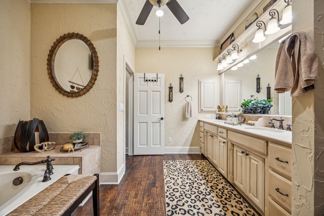 2590 King Arthur Blvd, Lewisville, TX 75056 - bathroom featuring ornamental molding, ceiling fan, a textured wall, wood finished floors, and a bath