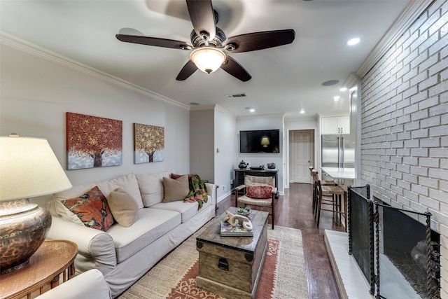 704 Winchester Dr, Richardson, TX 75080 - living area featuring ornamental molding, dark wood finished floors, a ceiling fan, and recessed lighting