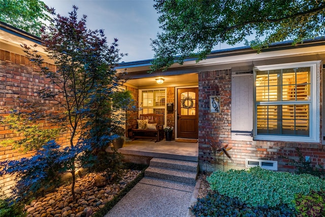 704 Winchester Dr, Richardson, TX 75080 - entrance to property with a porch and brick siding