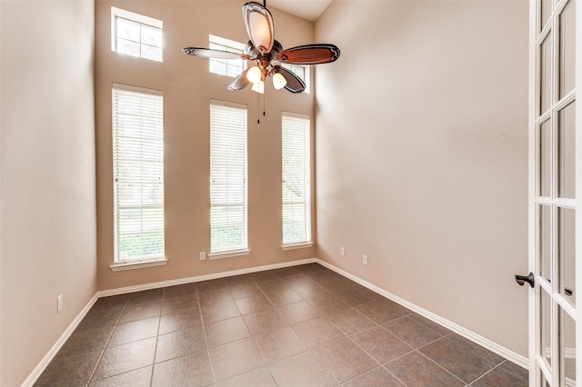 201 Barkley Dr, Hickory Creek, TX 75065 - empty room featuring a ceiling fan, healthy amount of natural light, and dark tile patterned flooring