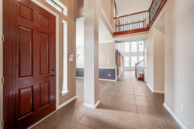 201 Barkley Dr, Hickory Creek, TX 75065 - entrance foyer featuring a high ceiling, tile patterned floors, baseboards, and stairway