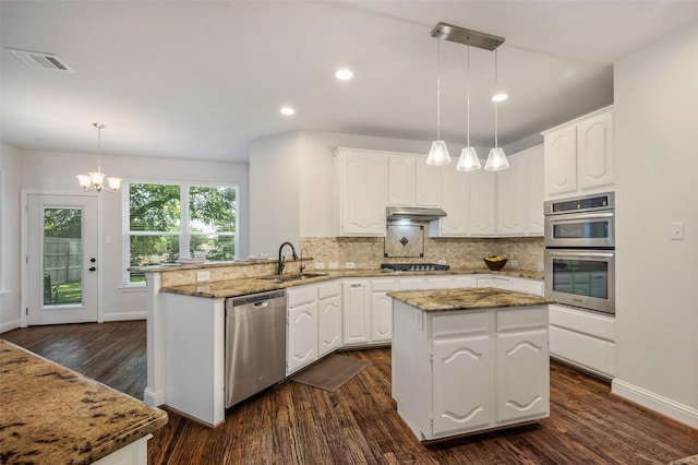 2145 Tartan Trl, Highland Village, TX 75077 - kitchen with appliances with stainless steel finishes, a peninsula, a sink, white cabinetry, and recessed lighting