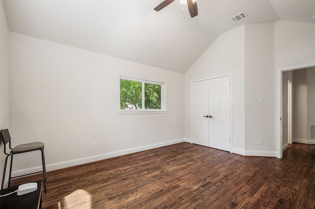 2145 Tartan Trl, Highland Village, TX 75077 - unfurnished bedroom featuring vaulted ceiling, dark wood finished floors, baseboards, ceiling fan, and a closet