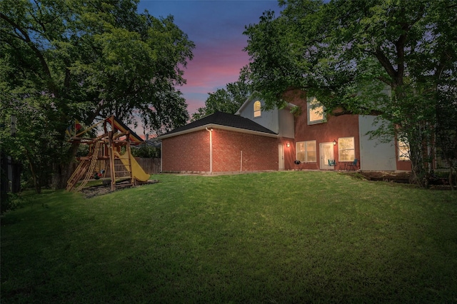 2145 Tartan Trl, Highland Village, TX 75077 - back of house featuring a playground and brick siding