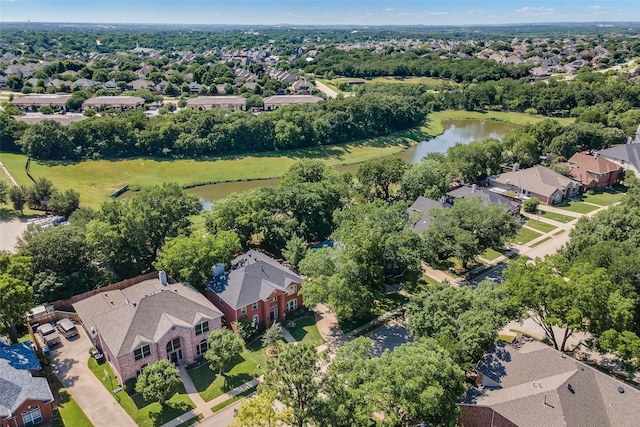 2145 Tartan Trl, Highland Village, TX 75077 - aerial view of residential area featuring a nearby body of water and a tree filled landscape