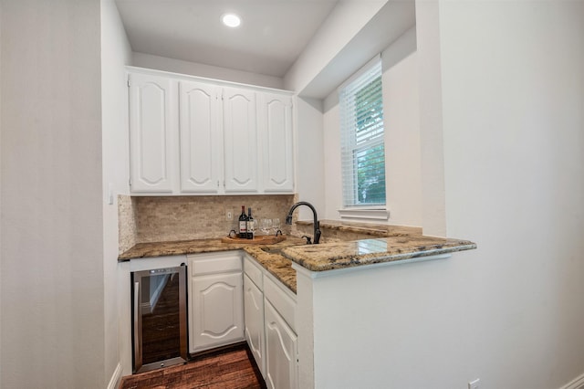 2145 Tartan Trl, Highland Village, TX 75077 - indoor wet bar featuring wine cooler, dark wood finished floors, and backsplash