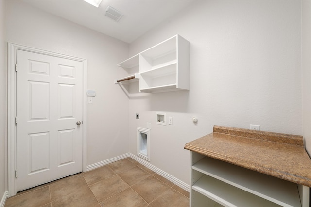 459 Bristol St, Roanoke, TX 76262 - laundry room with hookup for an electric dryer, hookup for a gas dryer, baseboards, hookup for a washing machine, and light tile patterned flooring