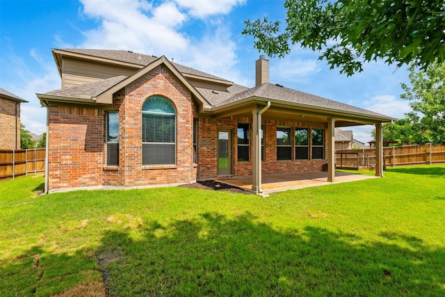 459 Bristol St, Roanoke, TX 76262 - back of house featuring a chimney, a patio, brick siding, and a shingled roof