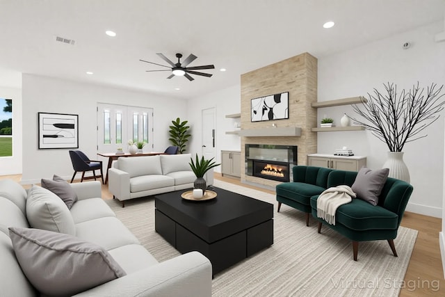 101 Crepe Myrtle, Corsicana, TX 75109 - living room featuring light wood finished floors, ceiling fan, recessed lighting, a large fireplace, and baseboards