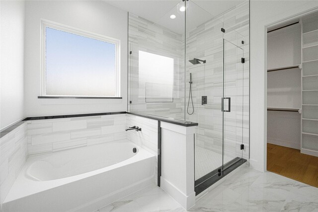 101 Crepe Myrtle, Corsicana, TX 75109 - bathroom featuring a garden tub, a stall shower, marble look tile flooring, and recessed lighting