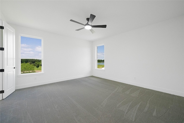 101 Crepe Myrtle, Corsicana, TX 75109 - unfurnished room featuring dark colored carpet, baseboards, and ceiling fan