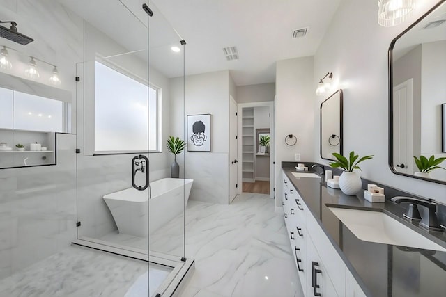 321 El Barco, Corsicana, TX 75109 - full bath featuring marble finish flooring, double vanity, a freestanding bath, and a shower with door