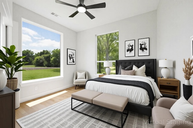 321 El Barco, Corsicana, TX 75109 - bedroom with multiple windows, light wood-type flooring, baseboards, and ceiling fan