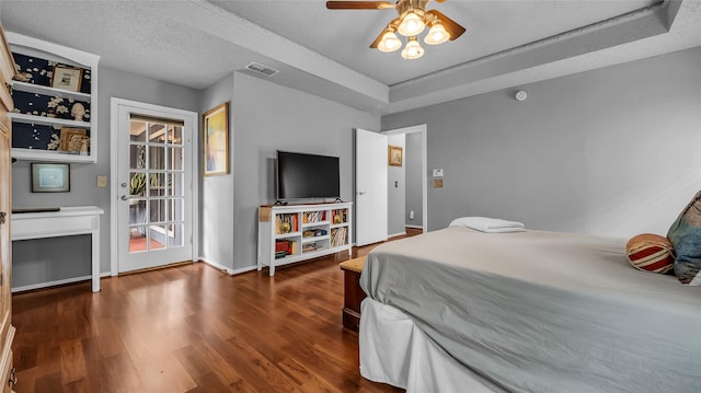 103 Shannon Dr, Allen, TX 75002 - bedroom with dark wood-style floors, a raised ceiling, baseboards, and a ceiling fan