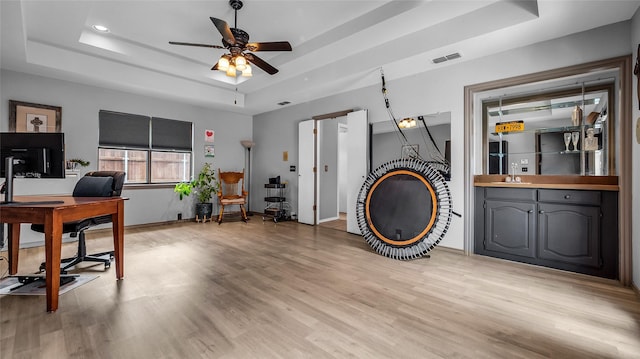103 Shannon Dr, Allen, TX 75002 - office featuring a raised ceiling, a sink, ceiling fan, light wood-style floors, and recessed lighting