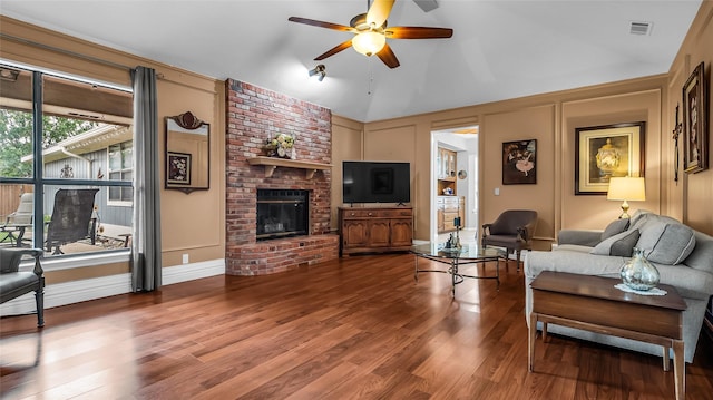 103 Shannon Dr, Allen, TX 75002 - living area featuring a decorative wall, ceiling fan, wood finished floors, a fireplace, and high vaulted ceiling