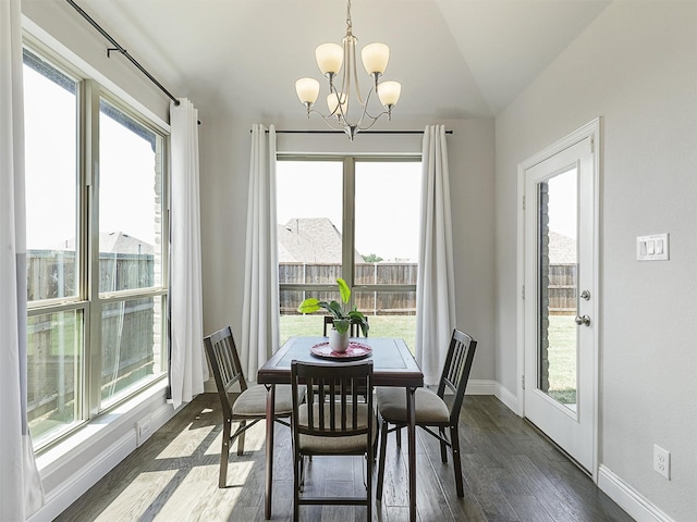 9713 Excursion Dr, Little Elm, TX 75068 - dining area with a chandelier, dark wood-style flooring, and baseboards