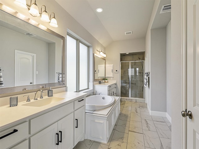9713 Excursion Dr, Little Elm, TX 75068 - bathroom with marble look tile flooring, a stall shower, two vanities, recessed lighting, and a bath