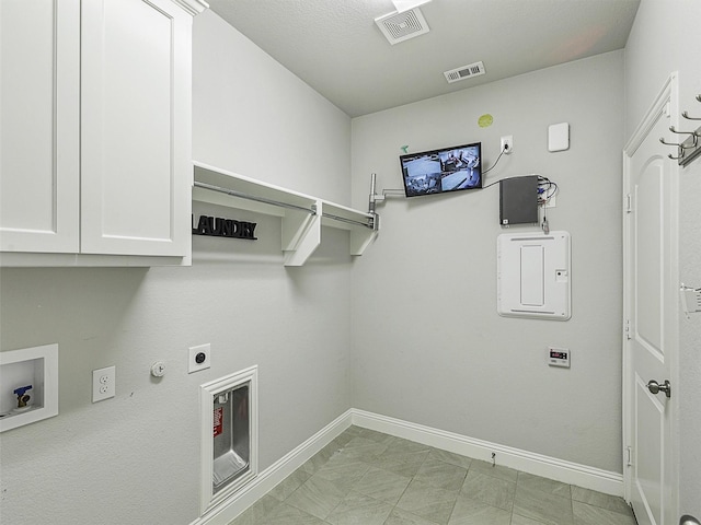 9713 Excursion Dr, Little Elm, TX 75068 - washroom with cabinet space, hookup for a gas dryer, electric dryer hookup, baseboards, and hookup for a washing machine