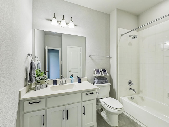 9713 Excursion Dr, Little Elm, TX 75068 - bathroom featuring vanity, toilet, shower / tub combination, and a textured wall