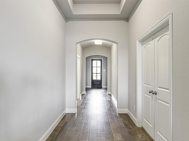 9713 Excursion Dr, Little Elm, TX 75068 - entryway featuring arched walkways, dark wood finished floors, and baseboards