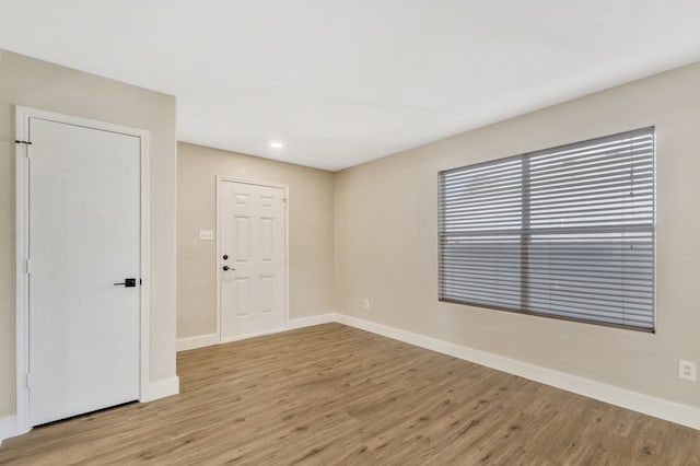 1946 Courtside Dr, Dallas, TX 75051 - spare room featuring light wood finished floors, baseboards, and recessed lighting