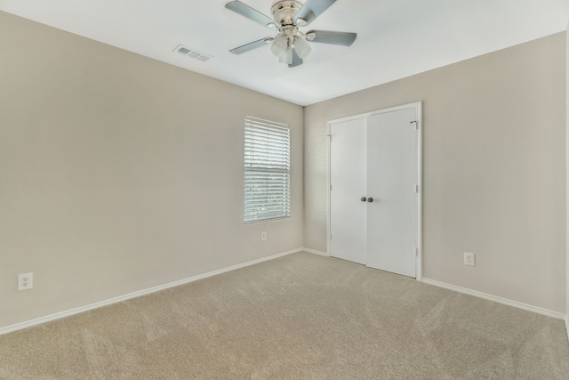 1946 Courtside Dr, Dallas, TX 75051 - unfurnished bedroom with light colored carpet, baseboards, a closet, and a ceiling fan